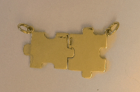 gold jigsaw pendant
